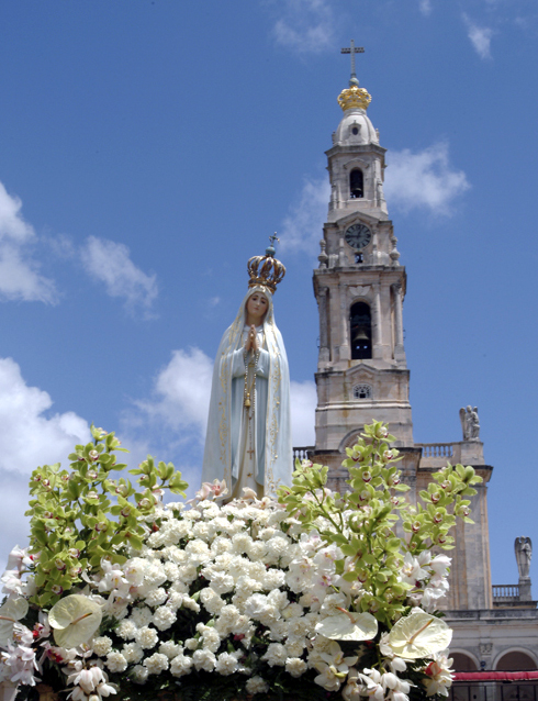 Pilgrim Virgin Statue of Our Lady of Fatima with the Basilica Behind